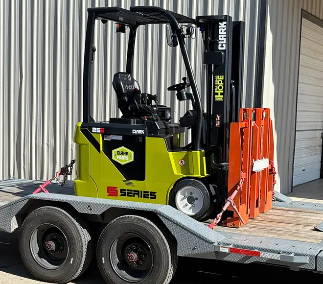 Clark forklift on a trailer for service